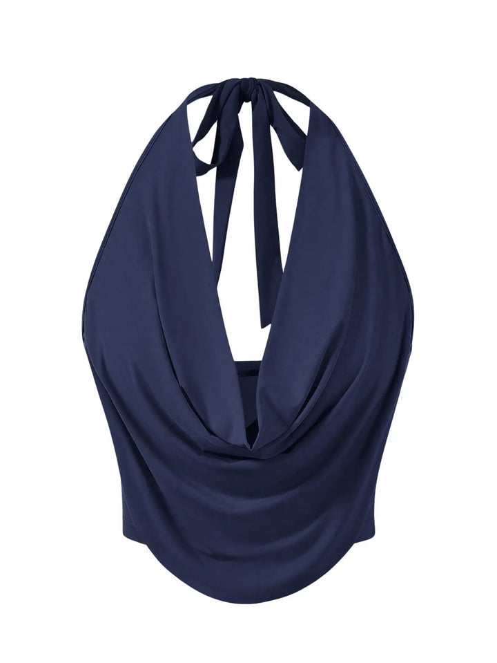 A navy blue halter-neck top with a draped, cowl-like front and tie-back straps, shown against a plain white background.