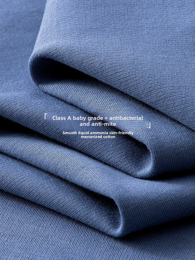 Folded blue fabric with white text overlay reading 'Class A baby grade + antibacterial and anti-mite' and 'Smooth liquid ammonia skin-friendly mercerized cotton'.