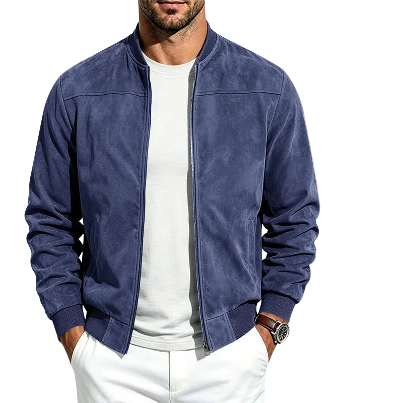 A man wearing a navy blue zip-up bomber jacket over a white t-shirt and white pants, with five smaller color variant thumbnails on the right side of the image.