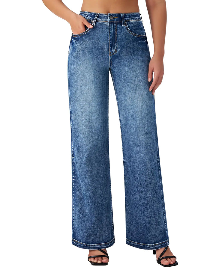 Blue jeans worn by a person on a white background