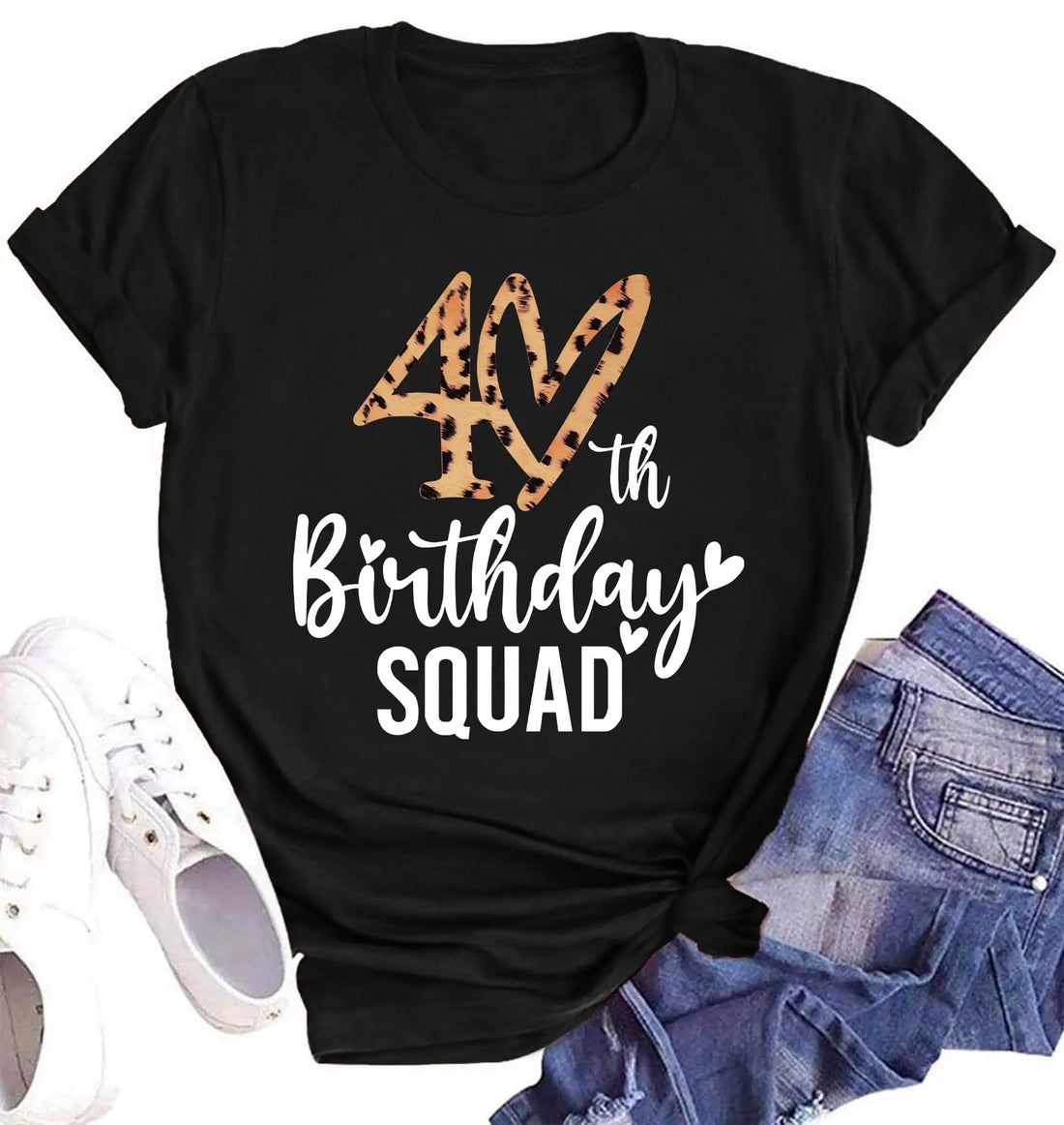 A black short-sleeve T-shirt laid flat with a leopard-print '40th Birthday SQUAD' graphic on the front, styled with white sneakers and blue denim shorts on a white background.