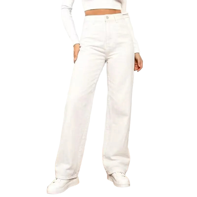 Person wearing white pants and shoes in a minimal indoor setting
