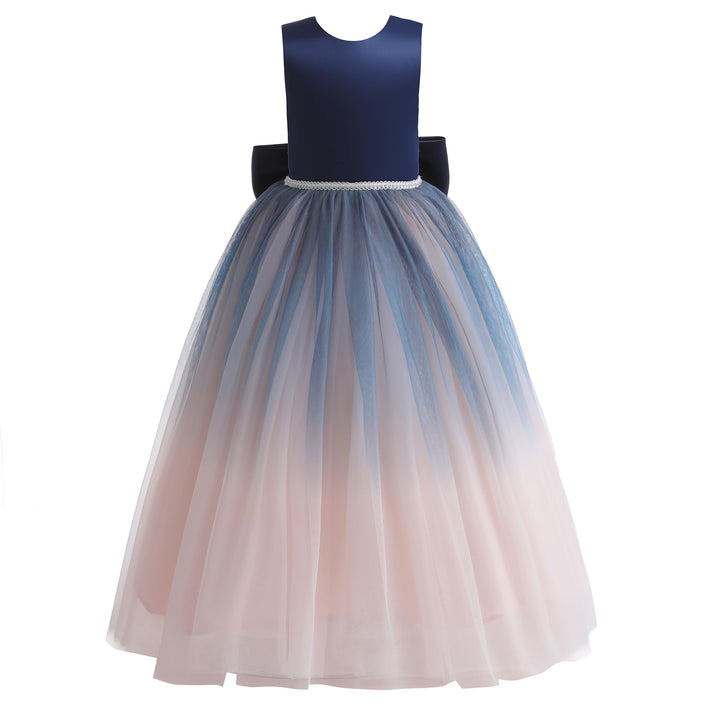 A sleeveless children's party dress with a solid navy blue bodice, a beaded waistband, and a voluminous tulle skirt that fades from blue at the top to pale blush pink at the bottom.