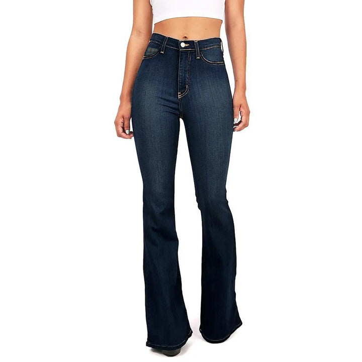 Person wearing blue flared jeans on a white background