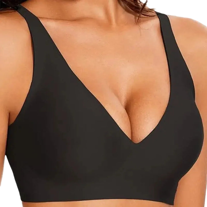 Black sports bra worn by a person on a white background