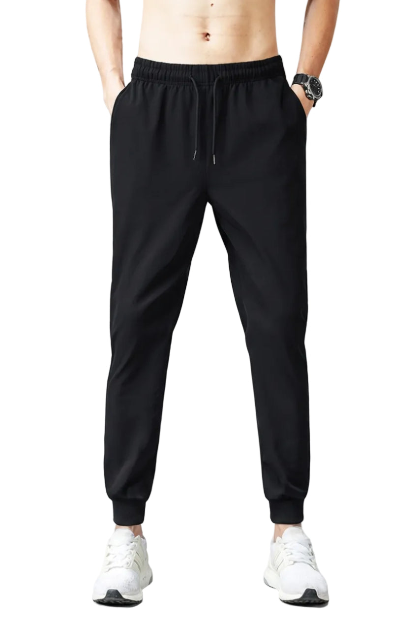 Person wearing black ice silk pants with text on a gray background