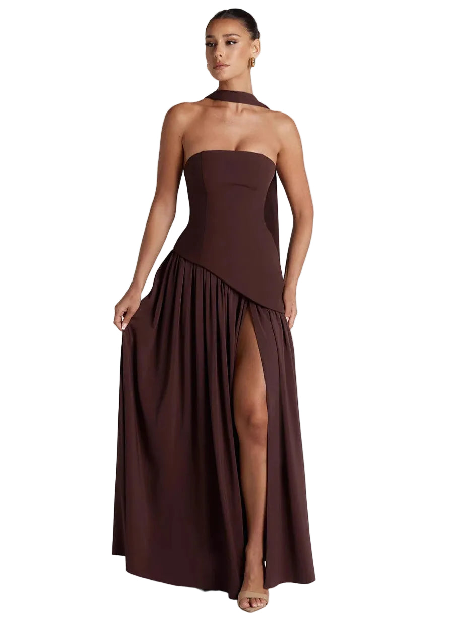 Woman wearing a brown strapless gown with a slit on a white background