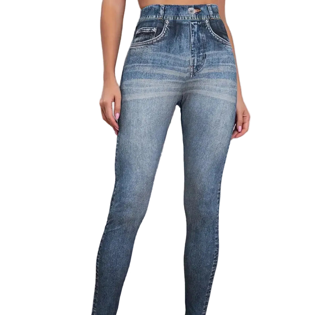 Blue jeans worn by a person against a white brick wall.