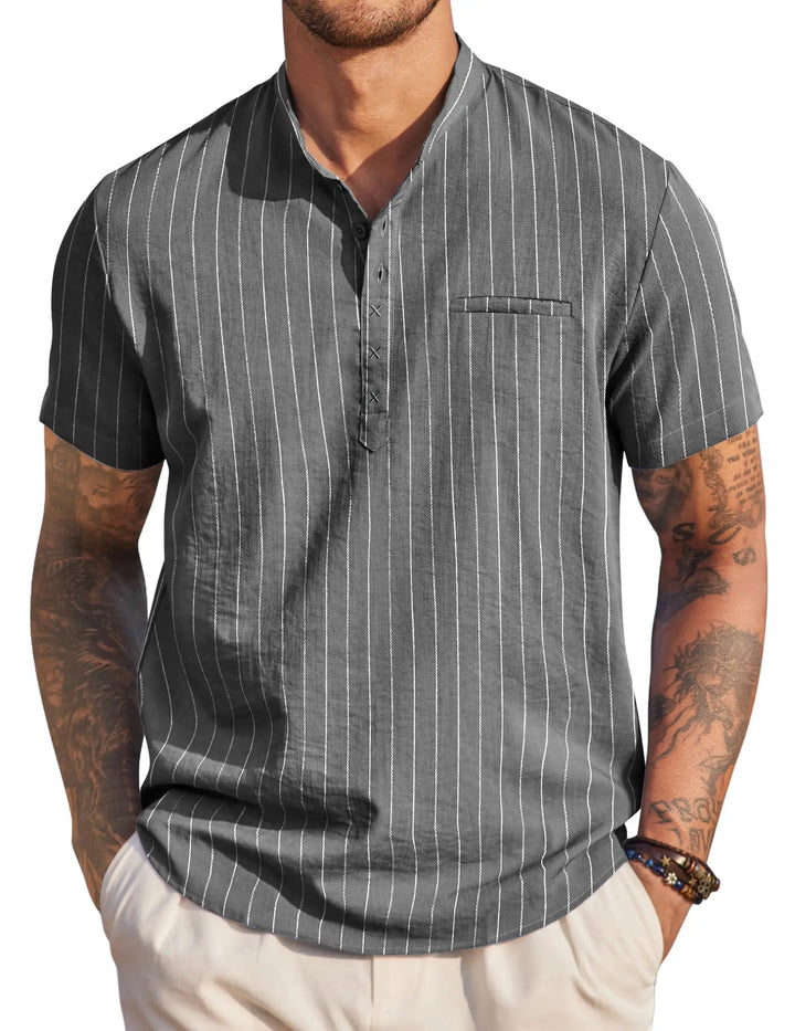 Man wearing a gray pinstripe short-sleeve shirt on a white background
