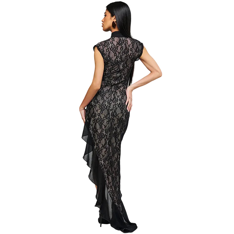 Woman wearing a black lace dress on a light gray background