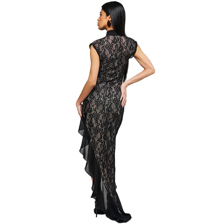 Woman wearing a black lace dress on a light gray background