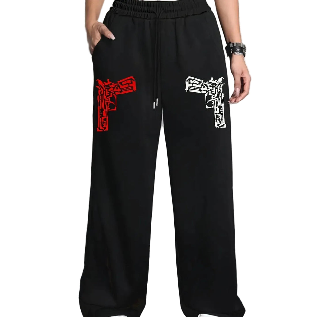 Black wide-leg sweatpants with a red and white graphic print on the left and right thighs, shown on a model in front of a white paneled wall.