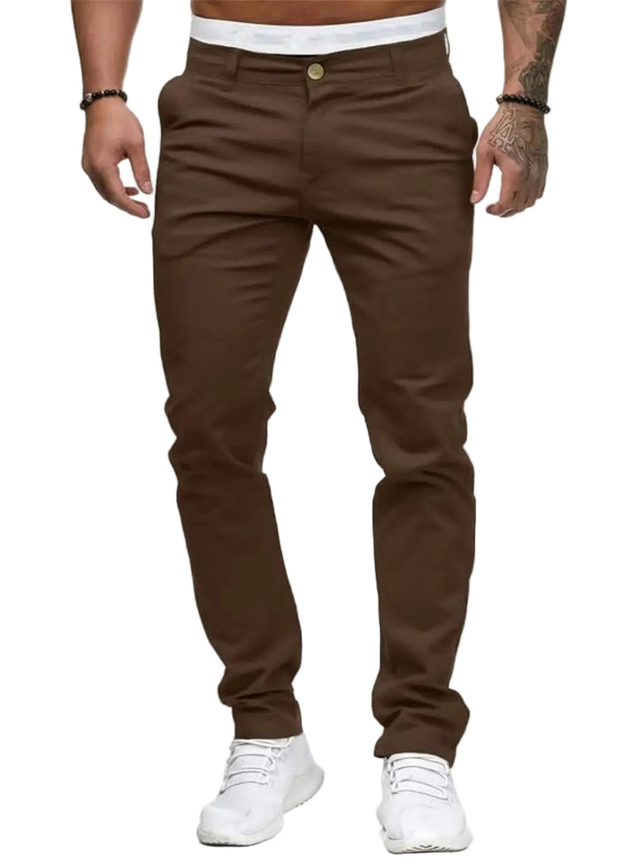 Brown pants worn by a person on a white background