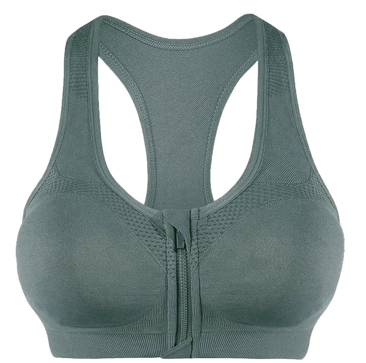 A sage green seamless bralette with a front zipper, shown from the back view against a plain white background.