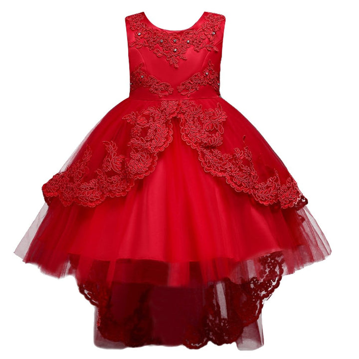 A red sleeveless party dress with a high-low tulle skirt, featuring intricate lace appliques, beaded embroidery on the bodice, and a tiered tulle construction.