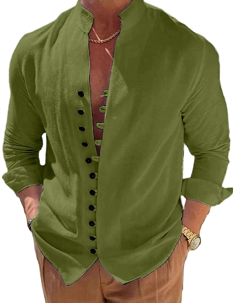 Person wearing a green button-up shirt with a scenic background