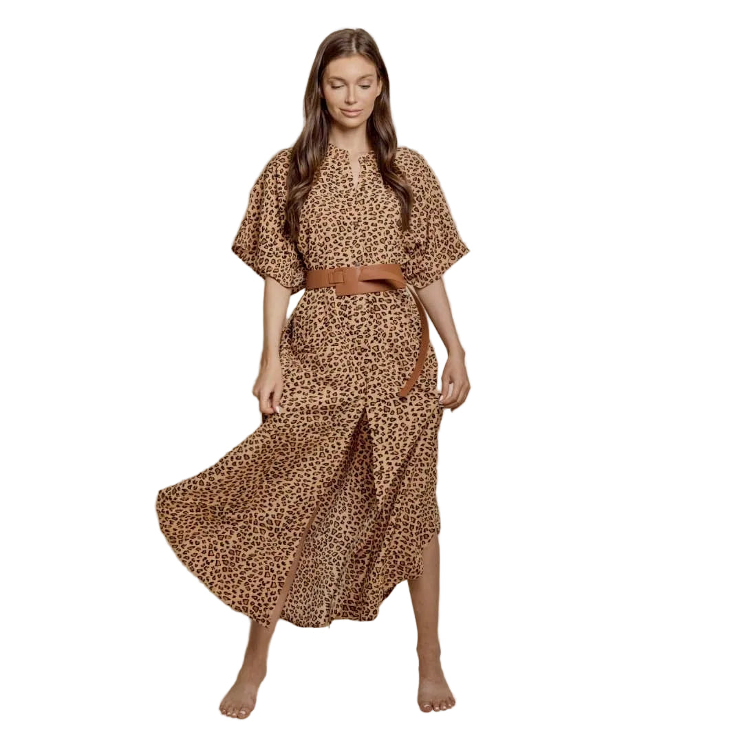 Woman wearing a leopard print dress with a belt on a beige background