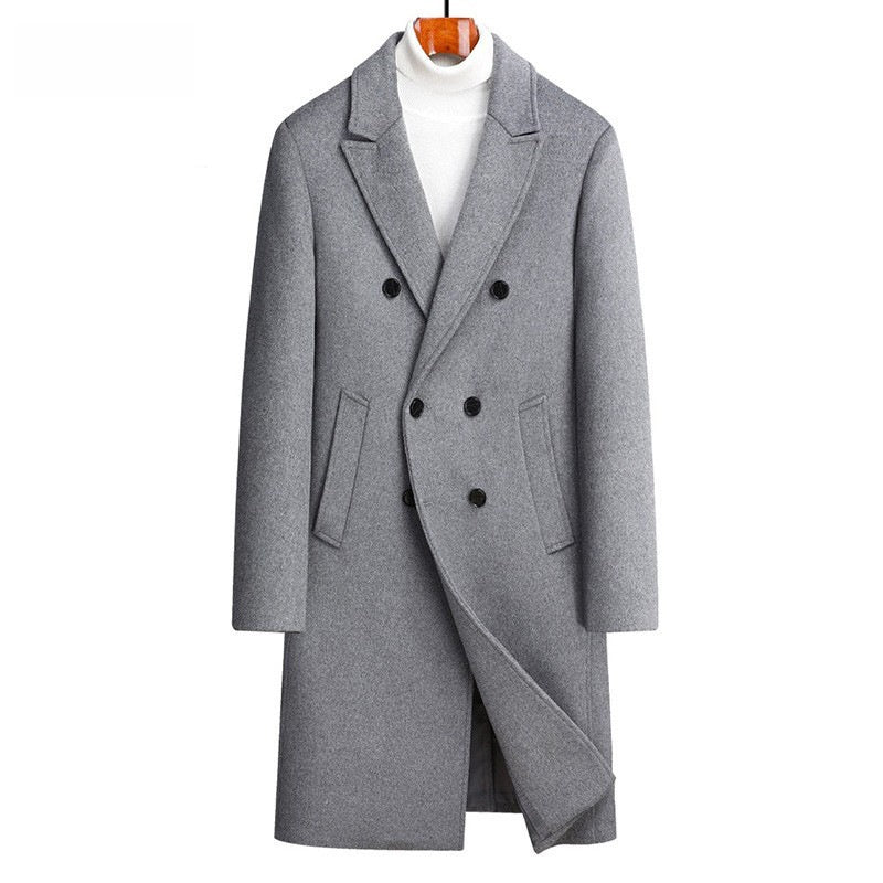 Gray overcoat on a hanger against a white background