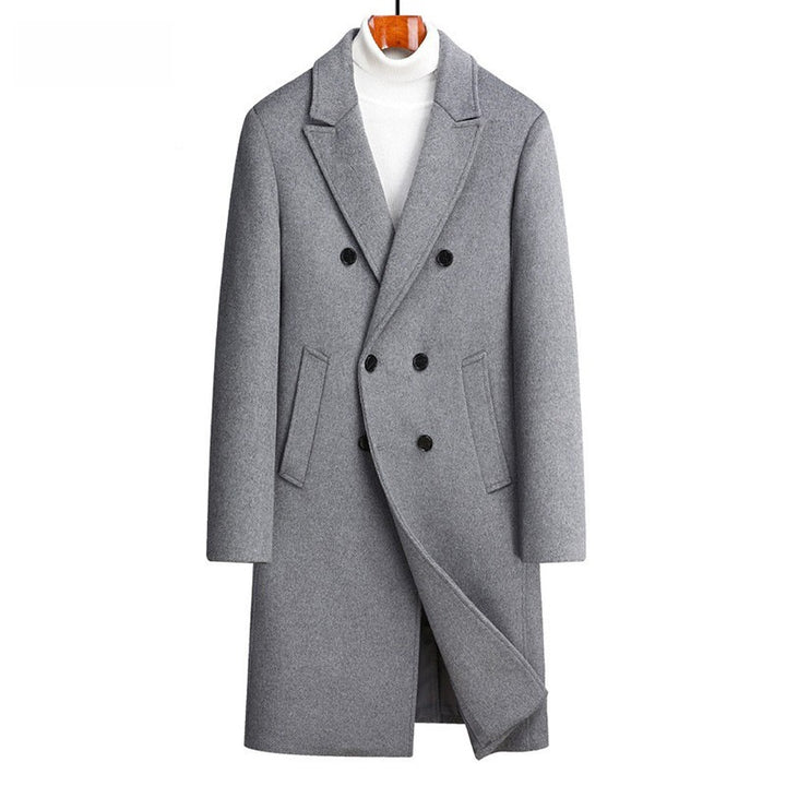 Gray overcoat on a hanger against a white background