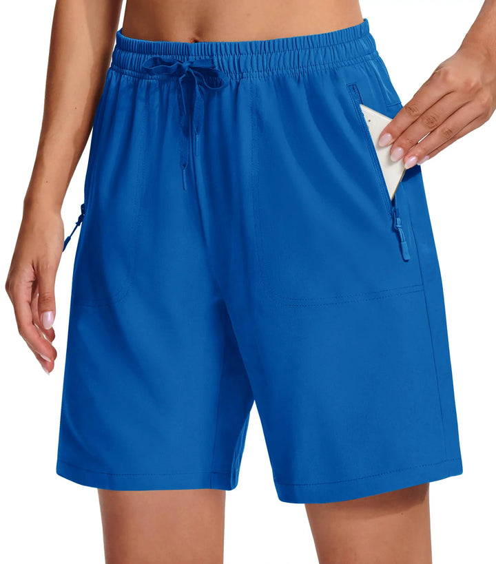 Blue shorts worn by a person on a white background