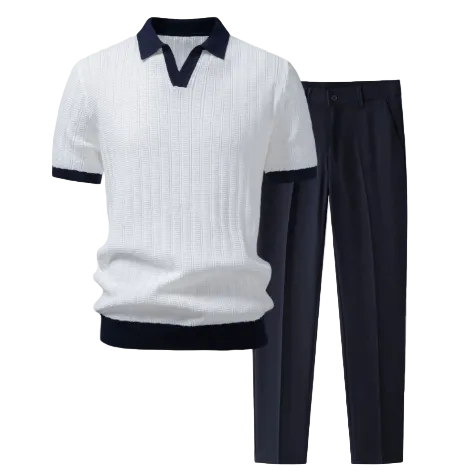A men's two-piece knit set featuring a white short-sleeve polo shirt with dark navy blue collar, sleeve cuffs, and hem, paired with dark navy blue trousers, shown against a light gray background.