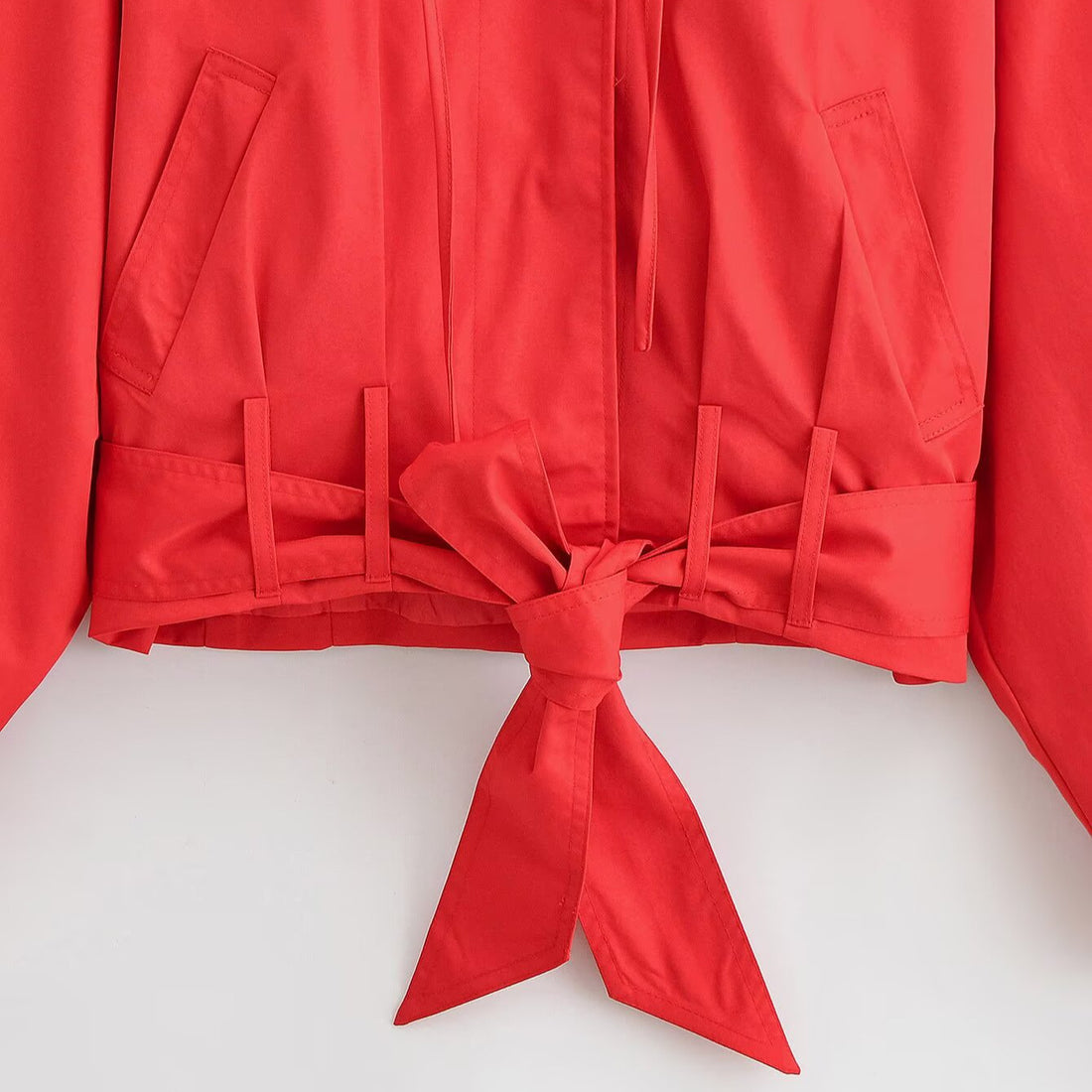 Pleated long sleeved high neck jacket with waistband