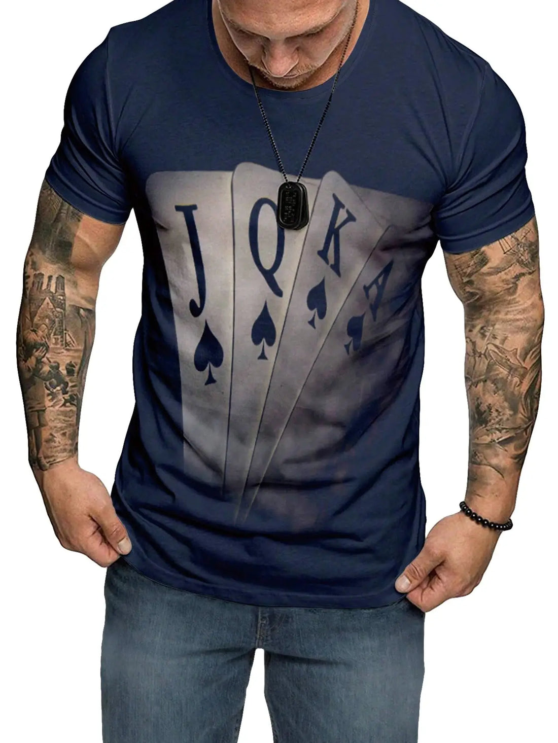 Man wearing a navy blue t-shirt with a graphic of playing card suits and text.