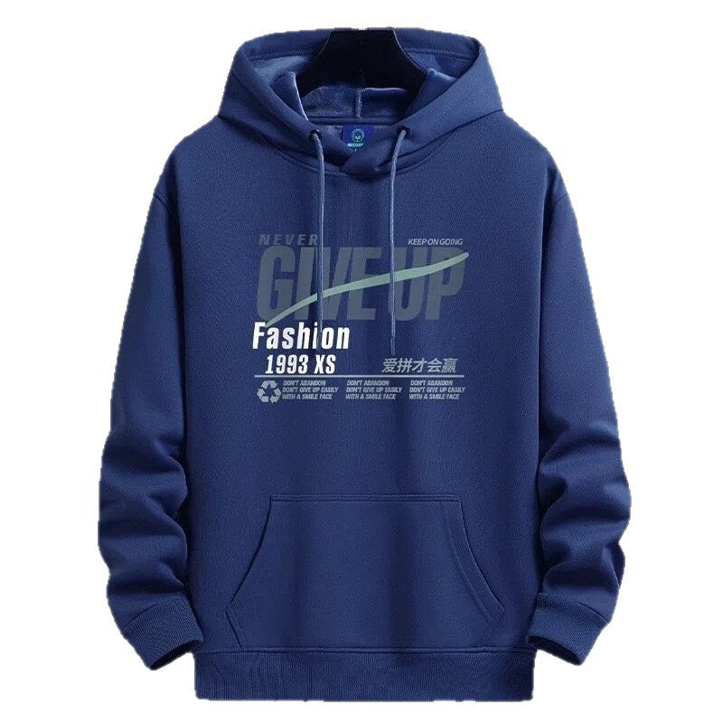 A navy blue pullover hoodie with a front kangaroo pocket and a graphic print on the chest. The graphic features the words 'NEVER GIVE UP', 'Fashion 1998 XS', and other text in white and light gray.