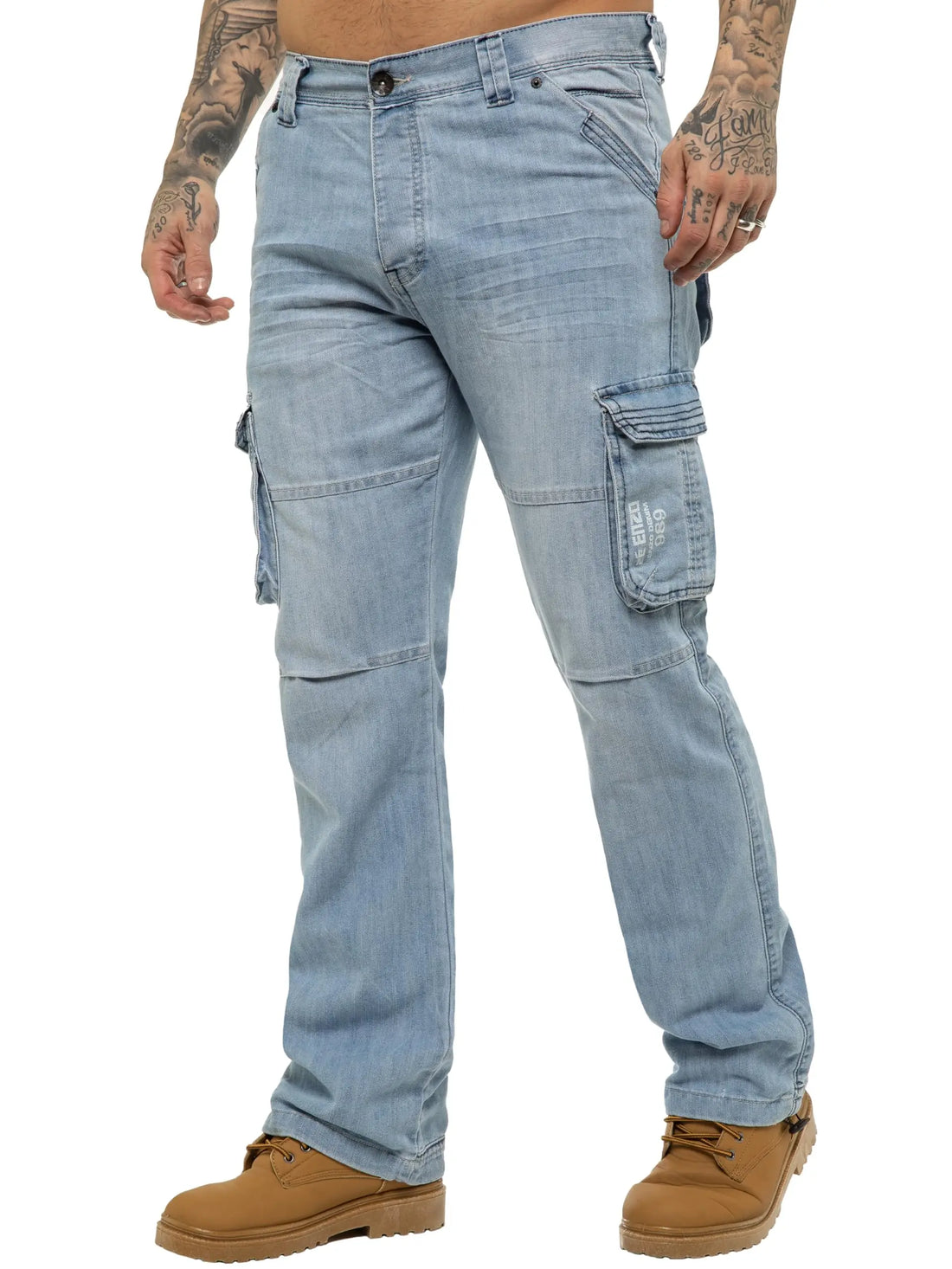 A person wearing light-wash blue denim cargo pants with flap side pockets and brown boots, shown from the waist down on a plain white background.