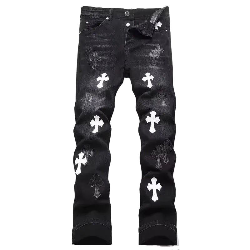 Black distressed denim jeans with white cross patches and faded wash details, shown flat against a white background.
