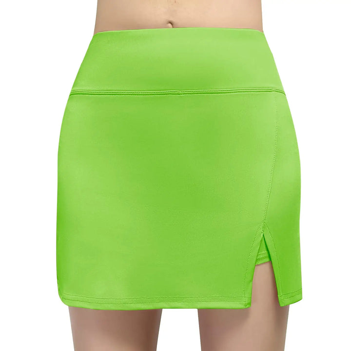 A bright lime green athletic mini skirt with a high waistband and a side slit, shown on a model against a plain white background.
