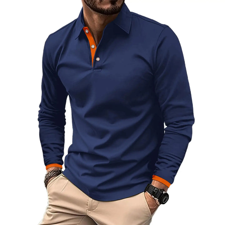 Man wearing a blue long-sleeve polo shirt with orange accents on a white background