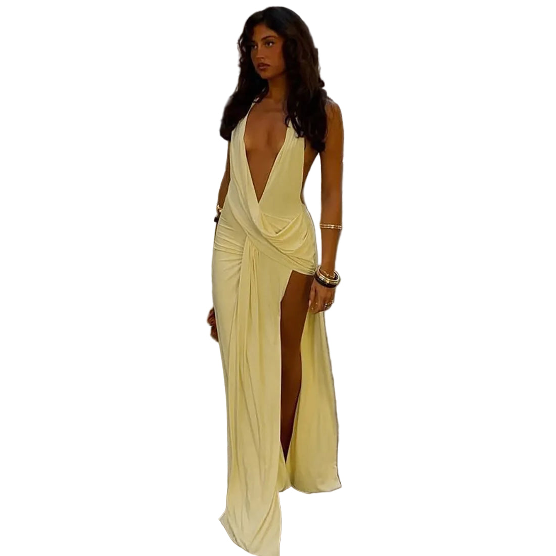 Woman in a yellow evening gown standing on a street with shops in the background