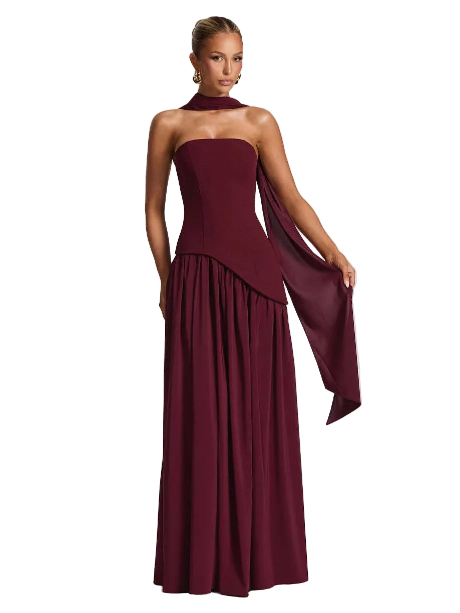 Burgundy evening gown with a draped design on a white background