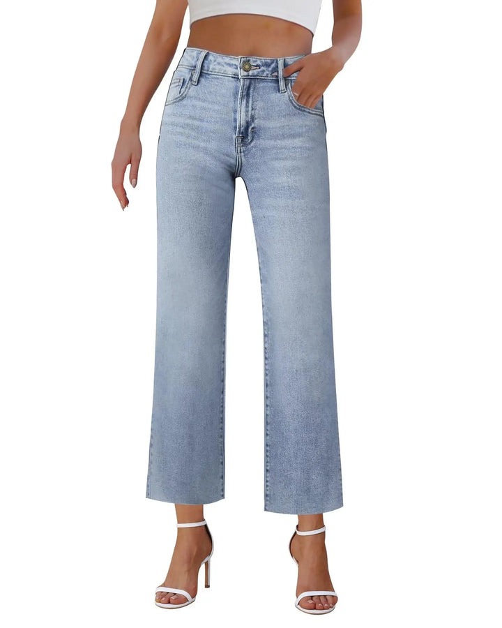Light blue jeans worn by a person on a white background