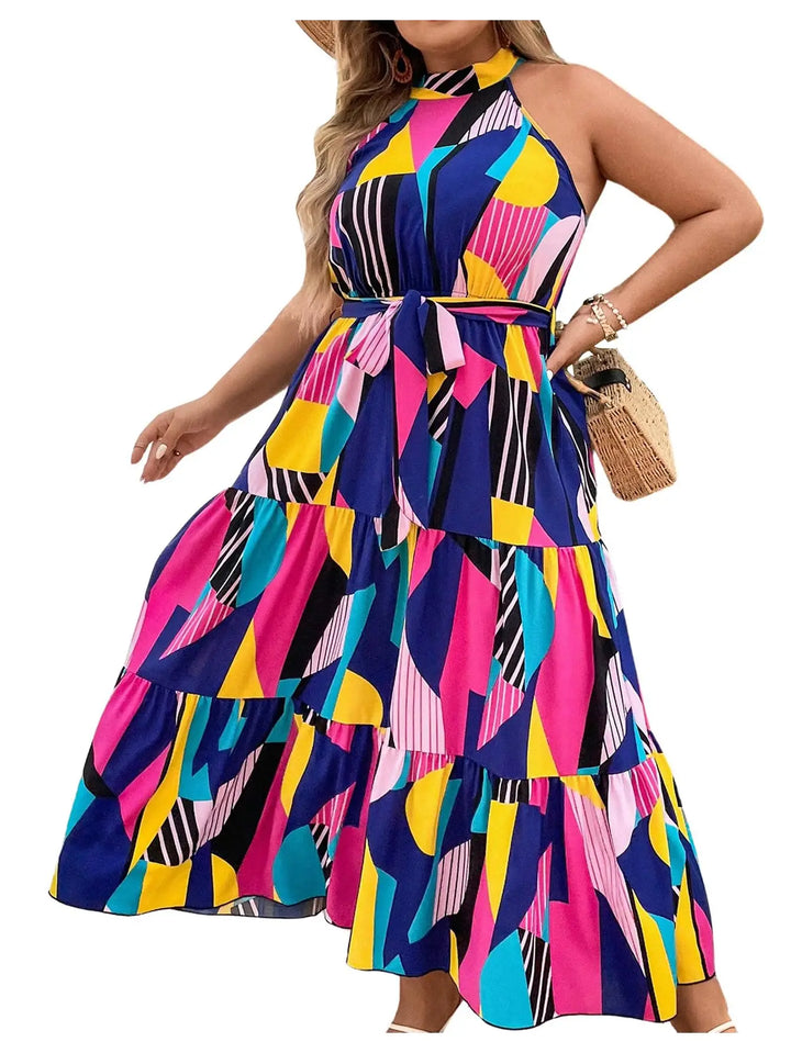 Colorful geometric patterned dress worn by a model on a white background