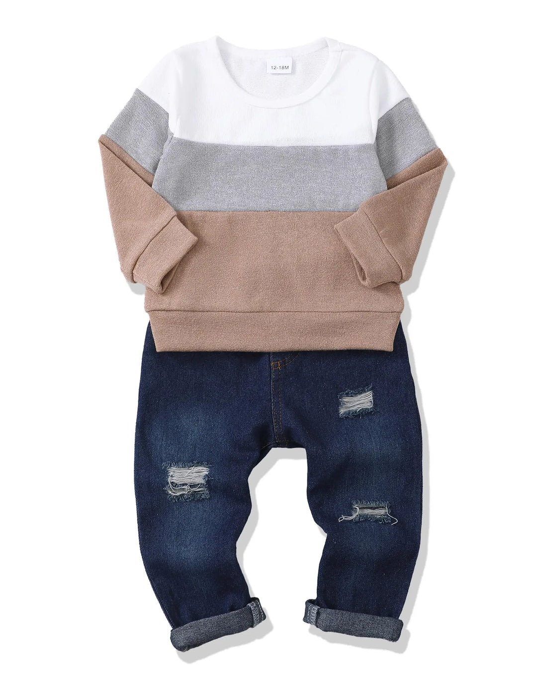 Children's outfit with a color-blocked sweater and distressed jeans on a white background