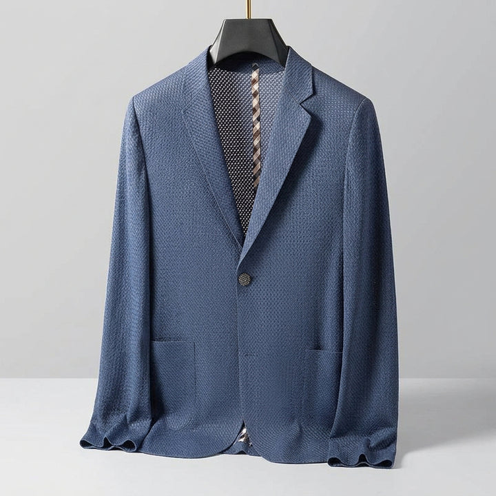 Blue textured blazer on a beige background