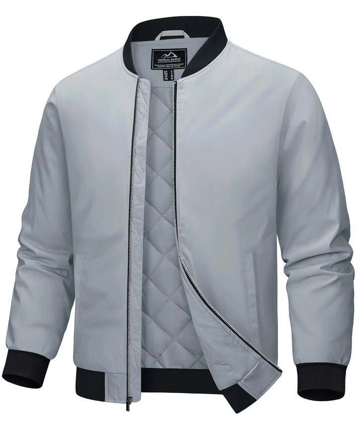 A light gray bomber jacket with black ribbed trim on the collar, cuffs, and hem, featuring a diamond-quilted lining visible through the open front zipper.