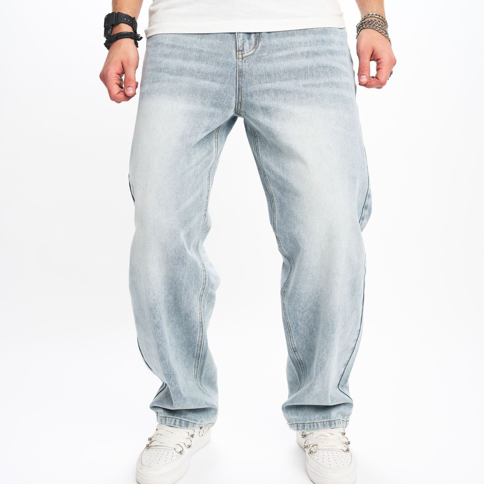 Light blue jeans worn by a person on a white background