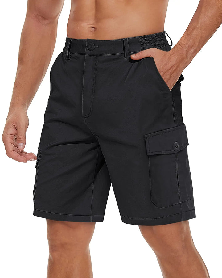 Black cargo shorts worn by a person on a white background