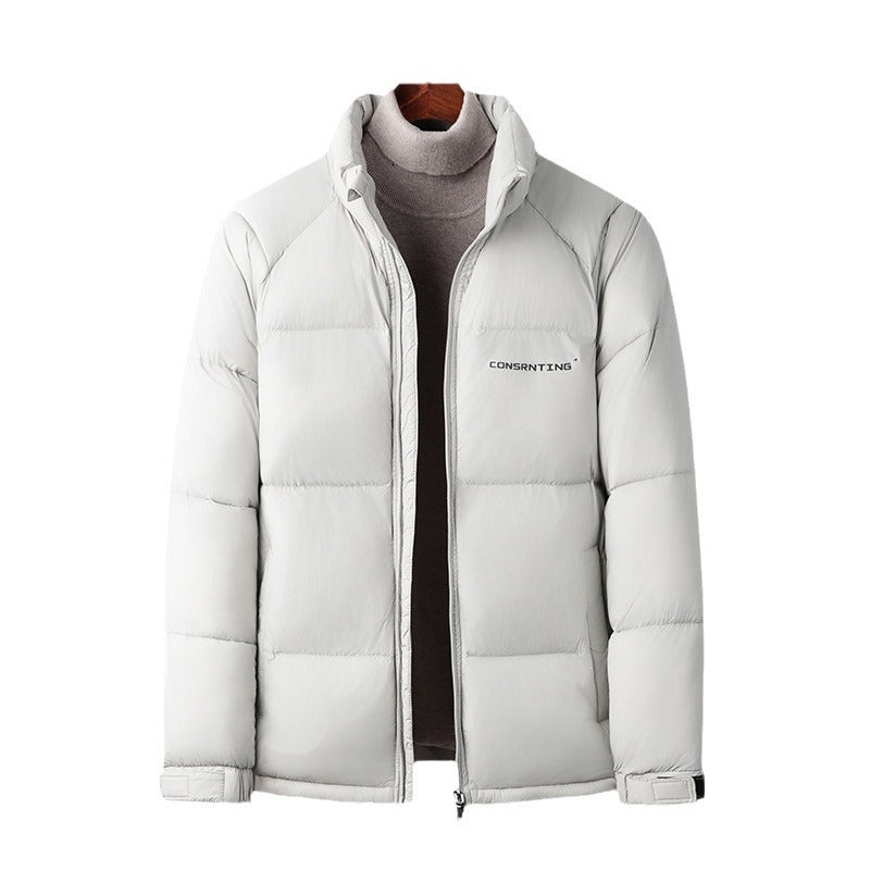 A light gray puffer jacket displayed on a mannequin torso over a gray turtleneck sweater. The jacket features horizontal quilting, a full front zipper, a stand-up collar, and the brand name 'CONSENT ZARA' printed in black on the left chest.