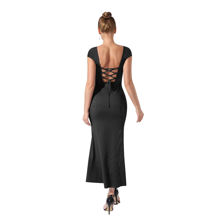 Woman wearing a black dress with a back design on a white background