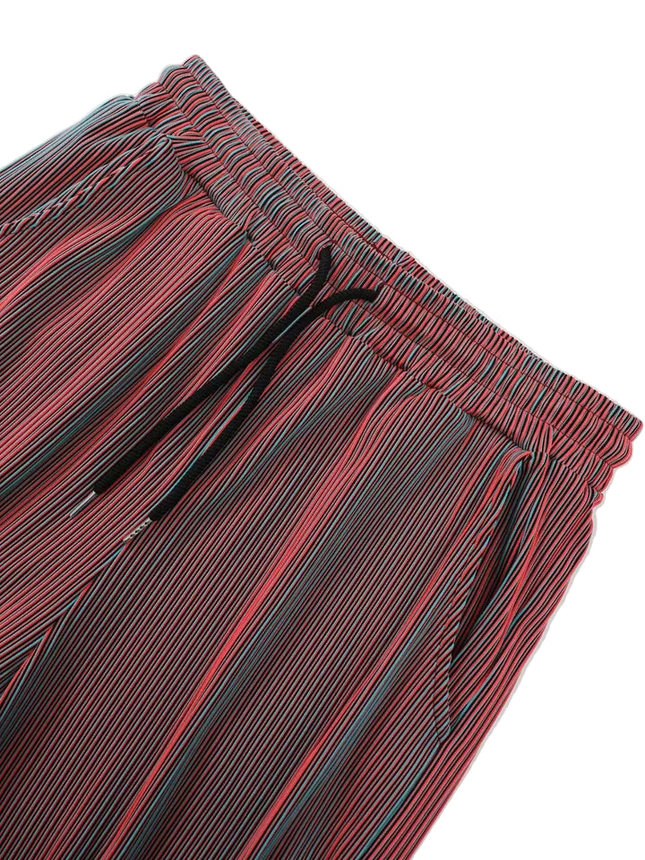 Red and black striped shorts with a drawstring on a white background