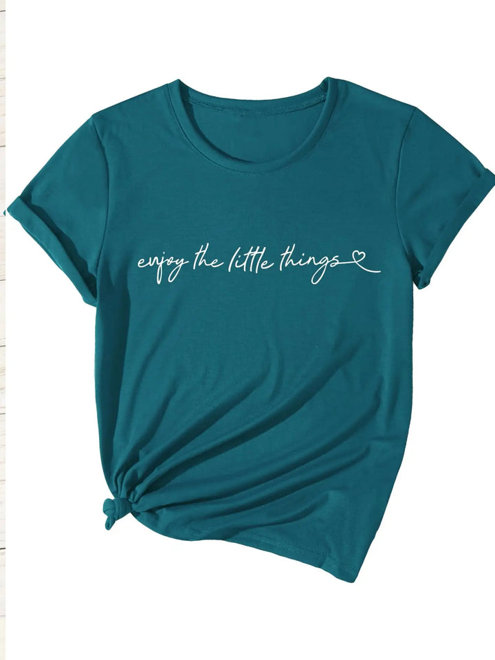 Teal t-shirt with 'enjoy the little things' text on a white background