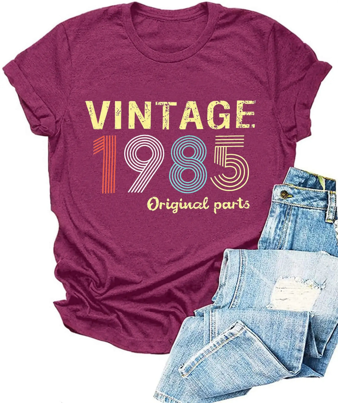 Maroon t-shirt with 'Vintage 1985 Original parts' text and blue jeans on a white background