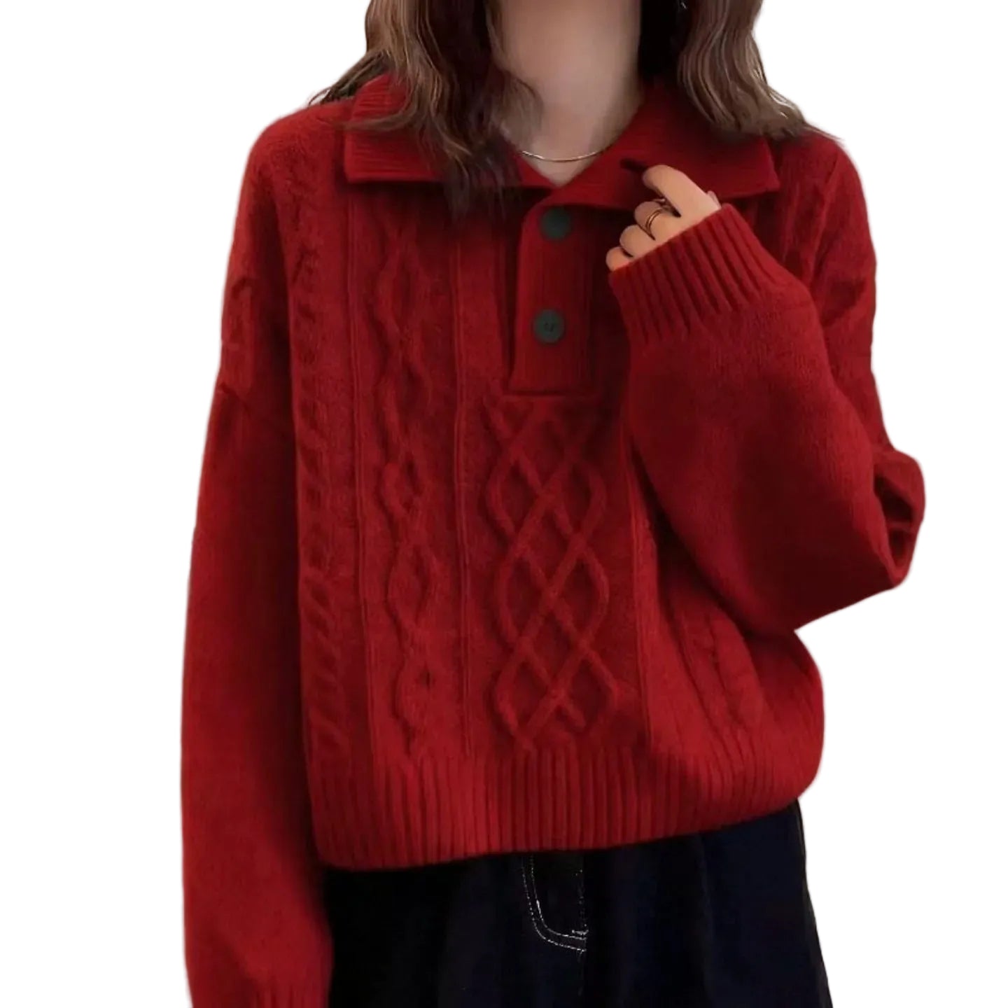 A person wearing a red cable-knit sweater with a collar and two dark buttons, paired with dark pants, shown against an indoor wall background.