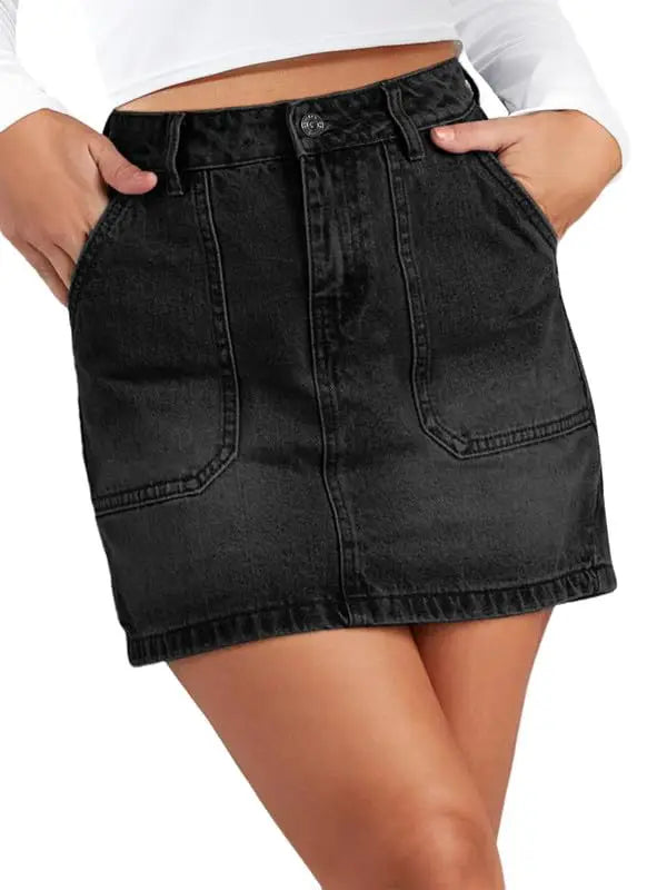 Black denim skirt worn by a person on a white background