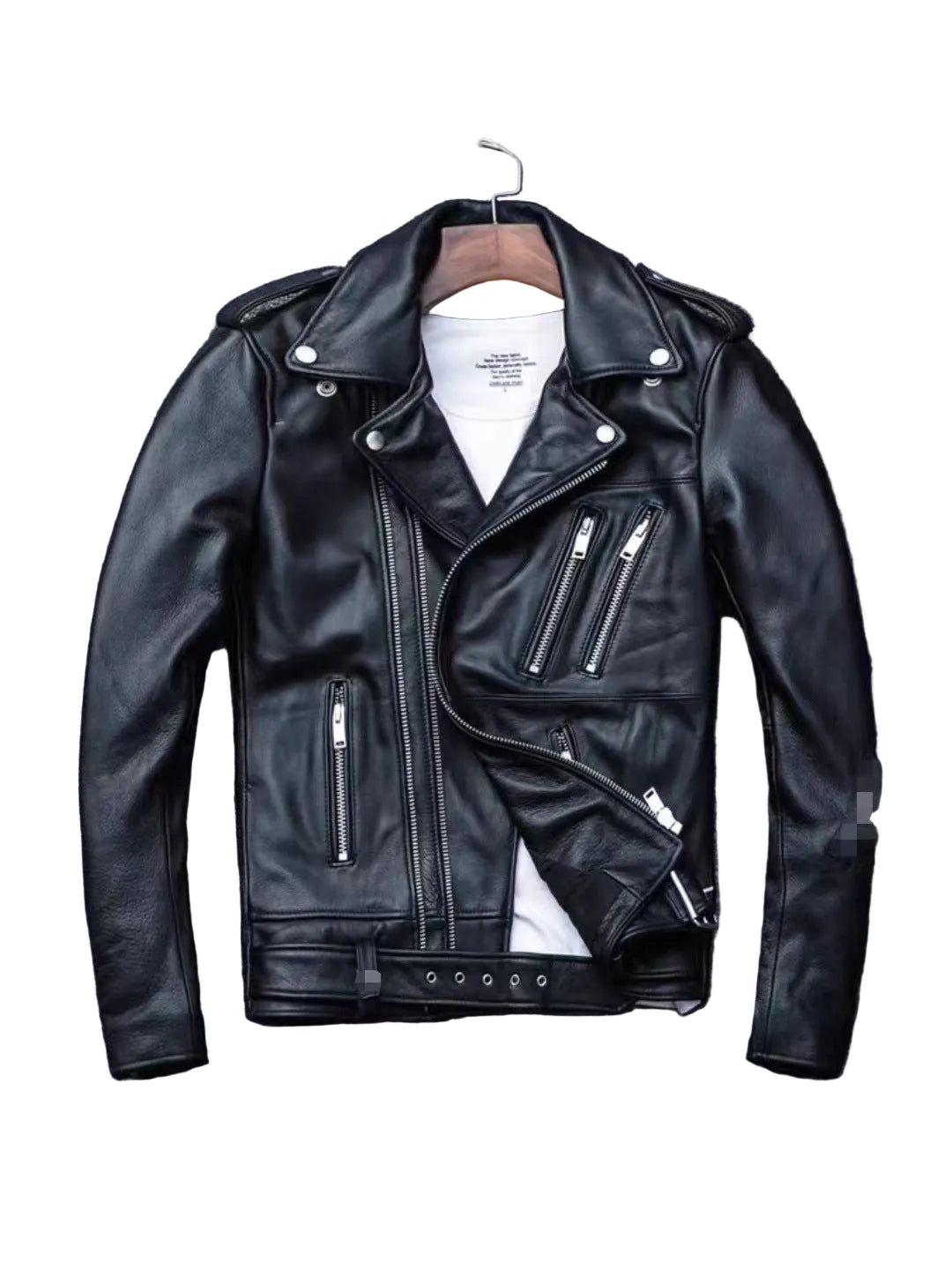 A black leather motorcycle jacket with silver zippers and snap details, displayed on a wooden hanger over a white t-shirt against a textured gray background.