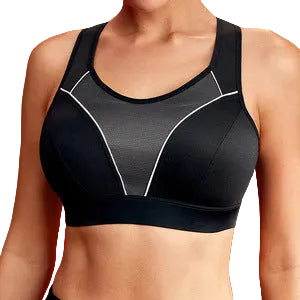 A close-up of a woman wearing a black sports bra with white contrast piping details, set against a solid red background.